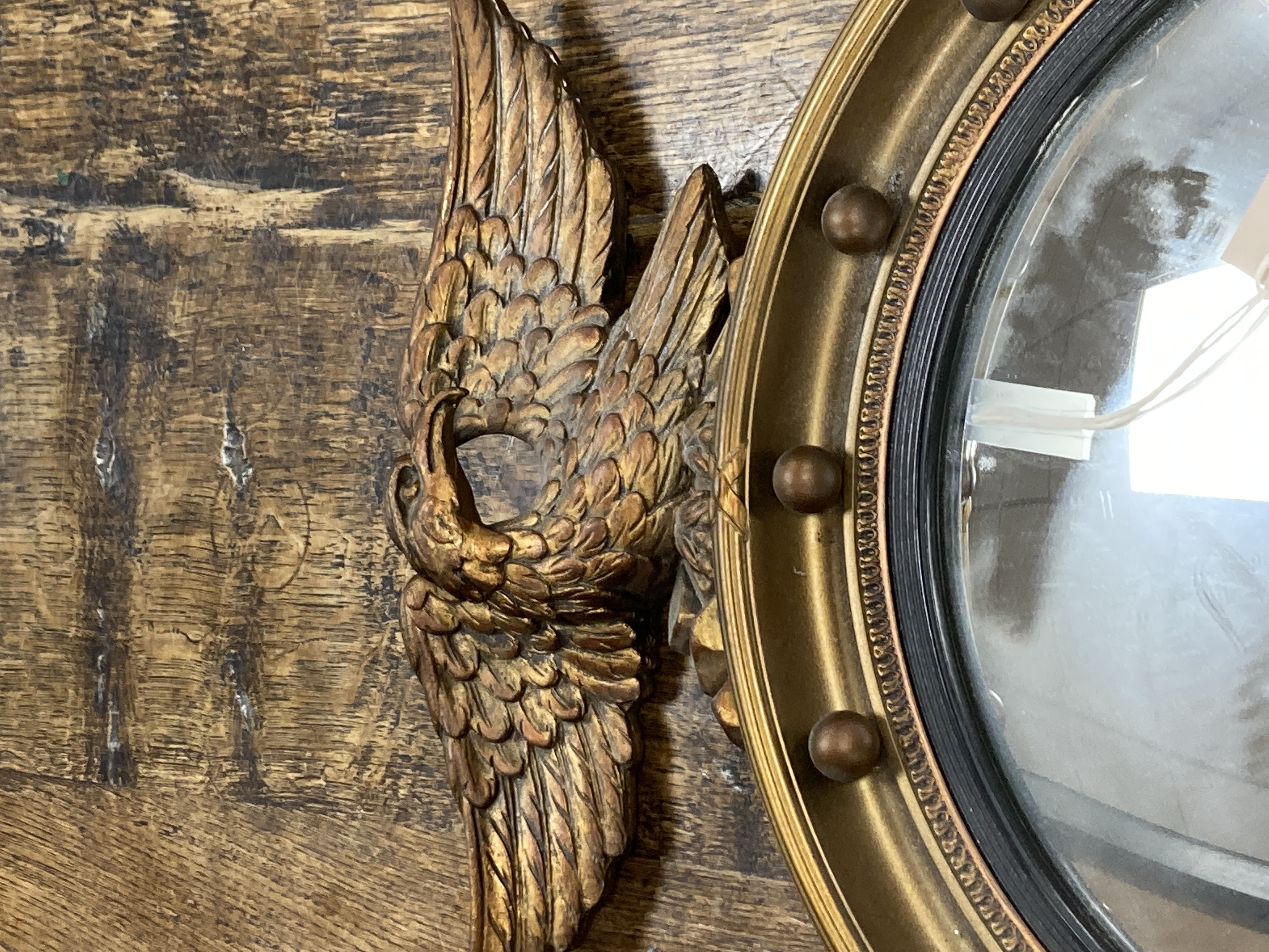 Two Regency style gilt-framed convex mirrors, larger 47cm diameter